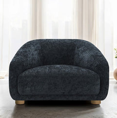 Aaron Contemporary Black Boucle Chair Sloped Arms Dark gray armchair in a room with white curtains