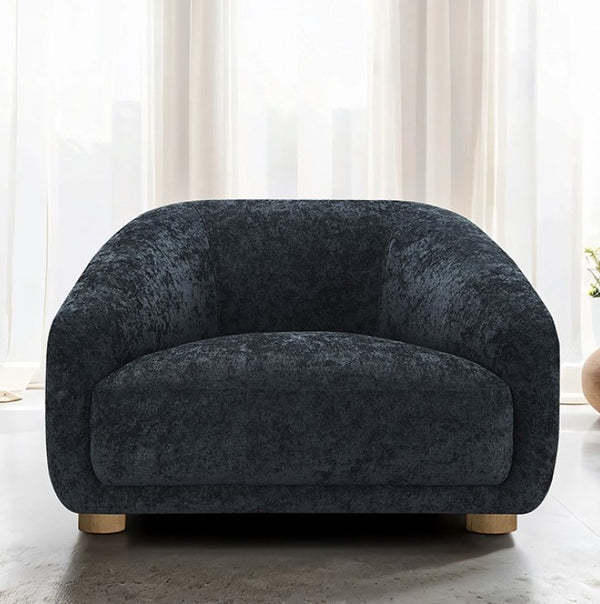 Aaron Contemporary Black Boucle Chair Sloped Arms Dark gray armchair in a room with white curtains
