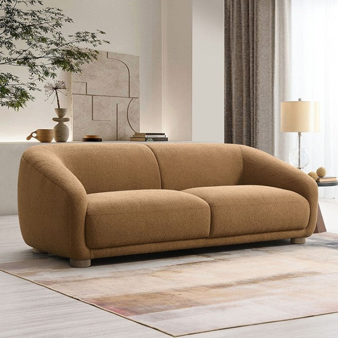 Aaron Contemporary Brown Boucle Sofa Sloped Arms Brown sofa in a modern living room with decor elements.