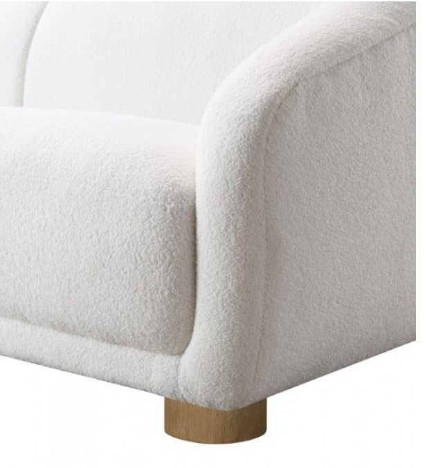 Aaron Contemporary White Boucl Sofa Sloped Arms White sofa in a modern living room with a neutral color palette.