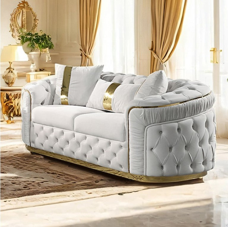 Adriana Glam Beige Loveseat Button Diamond Pleated Tufting Luxurious white sofa with gold accents in a stylish room.