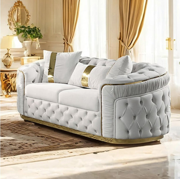 Adriana Glam Beige Loveseat Button Diamond Pleated Tufting Luxurious white sofa with gold accents in a stylish room.