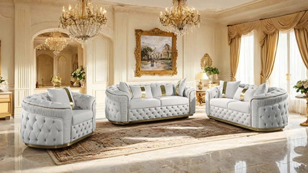 Adriana Glam Beige Sofa Button Diamond Pleated Tufting Luxurious living room with white tufted sofas, chandeliers, and decorative elements.