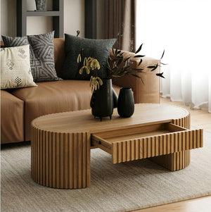Agata Coffee Table - Natural Ash Finish Wooden coffee table with decorative vases in a living room setting