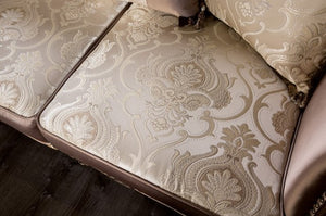 Albert Traditional Velvet Fabric Brown Sofa Close-up of a patterned sofa cushion on a wooden floor