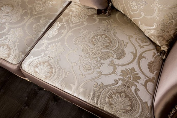 Albert Traditional Velvet Fabric Brown Sofa Close-up of a patterned sofa cushion on a wooden floor