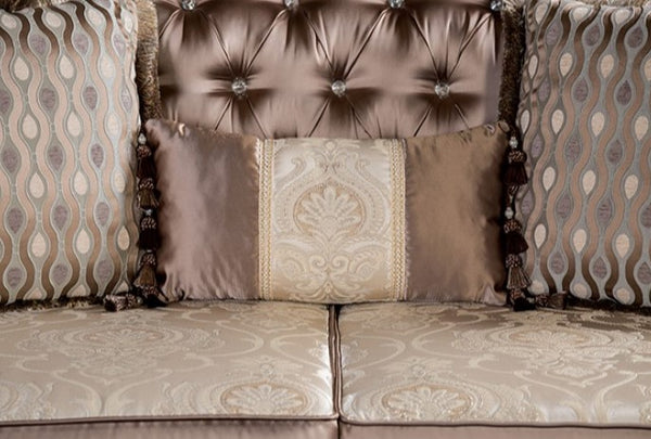Decorative sofa with patterned cushions and tufted backrest