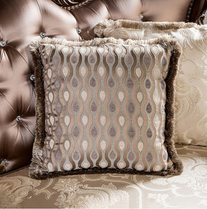 Decorative pillow with patterned design on a textured surface
