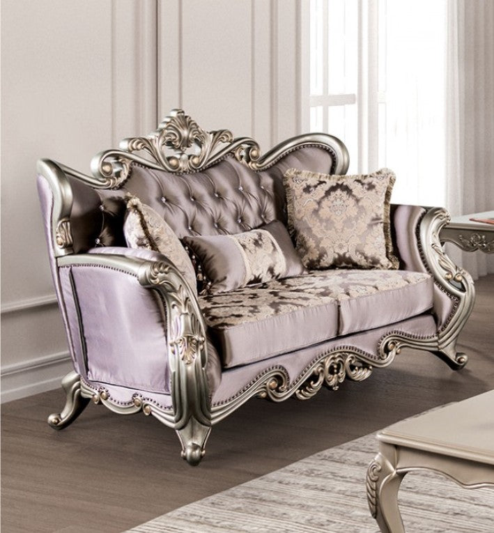 Albert Traditional Velvet Fabric Champagne Purple Loveseat Luxurious silver and gray sofa with ornate designs in a room with light-colored walls and a rug.
