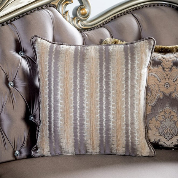 Decorative pillow with striped pattern on a plush sofa