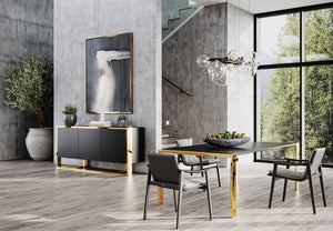 Alessa Modern Dining Table - Brass & Wenge Modern dining room with a glass table, black chairs, and a decorative wall piece.