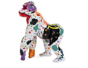 Alexi Multi Color Graffiti Gorilla Sculpture A colorful gorilla figurine or sculpture shown in profile against a plain white background. The body is primarily white with multicolored paint splatters and patches in purple, orange, black, green, red, and yellow.