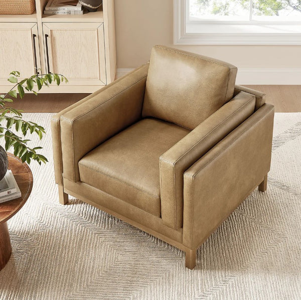 Amadeo Toast Vegan Leather Modern Chair Beige armchair in a room with a window and plant