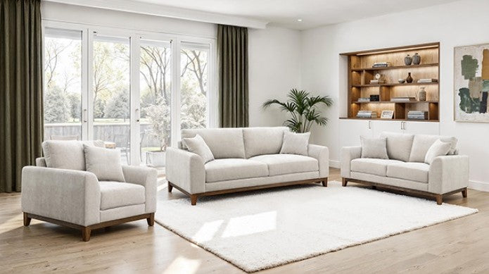 Light gray sofa in a living room with wooden shelves and decor.