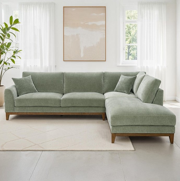 Arieal Mid-Century Modern Olive Green Chenille Fabric Sectional Green sectional sofa in a bright living room with a plant and artwork.