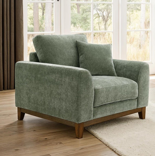 Arieal Mid-Century Modern Olive Green Chenille Fabric Chair Green armchair in a room with large windows and wooden flooring.
