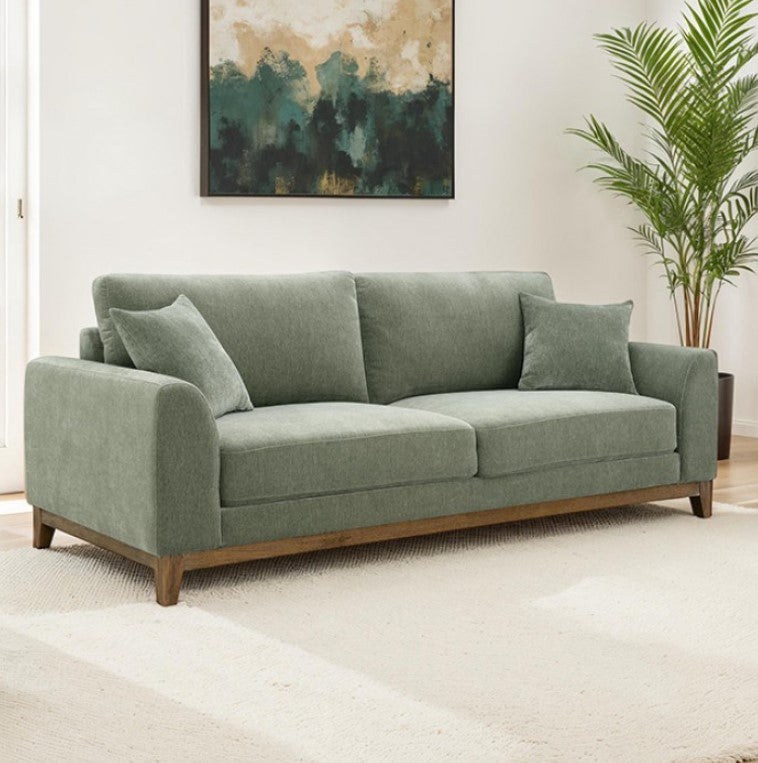 Arieal Mid-Century Modern Olive Green Chenille Fabric Sofa Green sofa in a room with a painting and plant