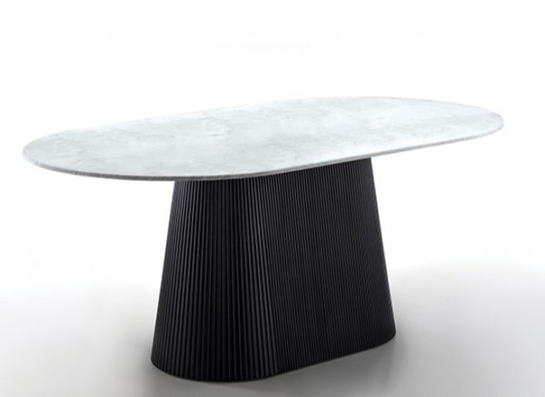 Arleto Modern Black White Top Oval Dining Table Modern table with a white marble top and black pleated base on a white background
