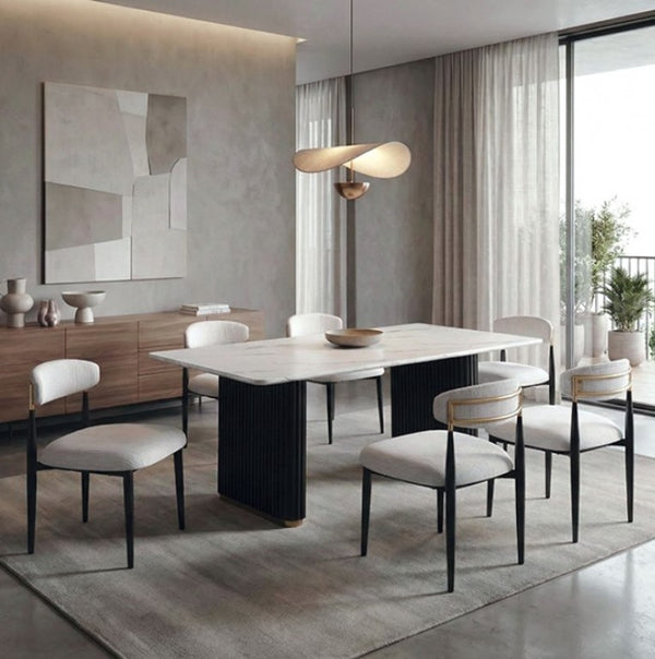 Arleto Modern Black White Top Rectangular Trestle Reeded Metal Base Dining Table Modern dining room with a white table and chairs in a stylish interior.