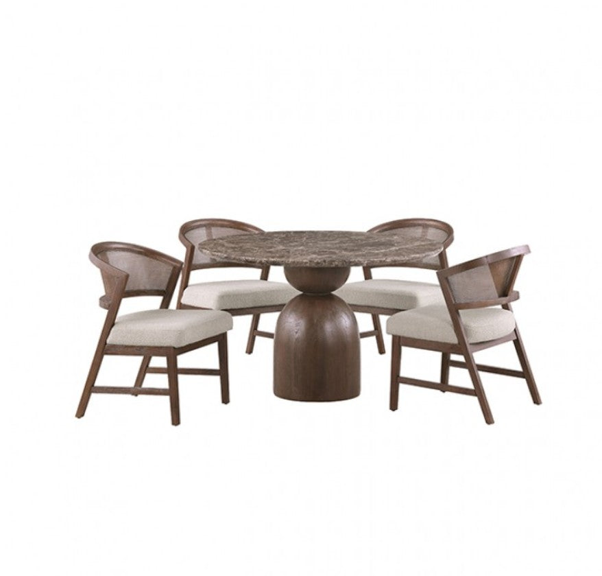 Artemos Contemporary Dark Brown Round Dining Table A round dining table with a polished stone top and a substantial dark wood pedestal base, accompanied by two matching wooden chairs with woven backs and cream upholstered seats. The table is styled with a ceramic vase of branches, glasses, and stacked plates in a softly lit dining room.