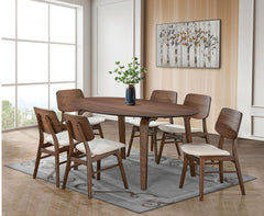 Artemos Mid Century Walnut Oval Dining Table A 7-piece wooden dining table set with six mid-century modern chairs featuring cream upholstered seats, arranged on a gray patterned rug in a bright, contemporary dining room.