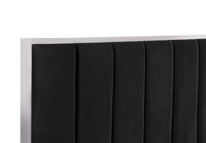 Ashysko Black Silver Fully Upholstered Bed Close-up of a black upholstered headboard with vertical channel tufting and a light wood or beige side frame, shown against a plain white background.