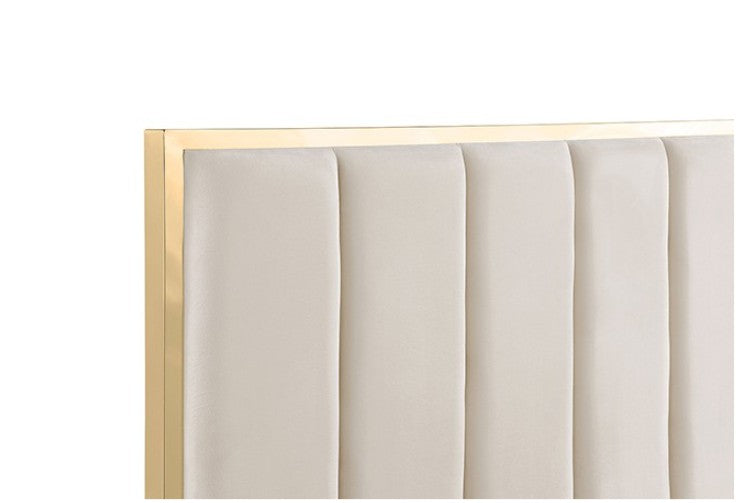 Ashysko White Gold Fully Upholstered Bed A luxury modern bedroom featuring a white upholstered bed with gold trim, matching white nightstands, a large circular crystal chandelier, and beige walls and marble floors.