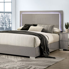 Asiko Modern Led Headboard Light Taupe Bed A modern gray bed frame with a rectangular headboard featuring purple LED backlighting, styled with striped and solid beige bedding, a dark gray throw blanket, and matching pillows in a bright bedroom setting.