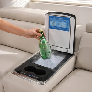 Aurelia Beige Modern Air Leather Sectional Sofa Powered Recliner A beige leather sofa with a built-in beverage center tray. A hand is placing a green glass bottle into a cooling tray with visible steam, and an open lid above shows a blue temperature display panel.