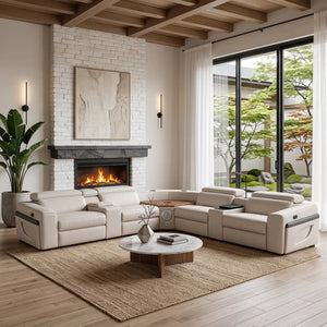 Aurelia Beige Modern Air Leather Sectional Sofa Powered Recliner A modern sectional sofa in light beige leather arranged in an open U-shape in a bright, contemporary living room with a white brick fireplace, large windows, and a wooden coffee table on a woven rug.