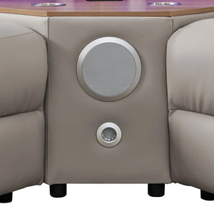 Aurelia Modern 5 Seat Sectional Sofa Powered Recliner Beige leather surround sound system for a home theater, featuring a large circular speaker on the center console panel and a smaller subwoofer below it.