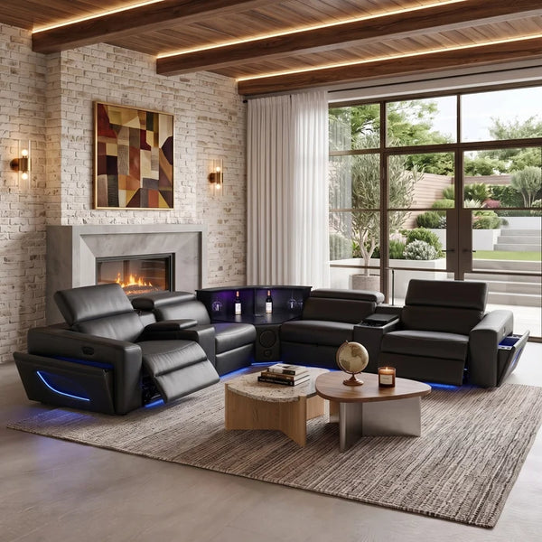 Aurelia Modern Air Leather Sectional Sofa Powered Recliner A modern black leather recliner sofa set with built-in blue LED lighting, styled in a contemporary living room with a fireplace, brick walls, large windows, and a wooden coffee table.