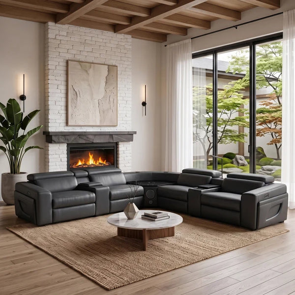Aurelia Modern Air Leather Sectional Sofa Powered Recliner A modern black leather sectional sofa arranged in an L-shape in a stylishly decorated living room with a fireplace, large windows, and a wooden coffee table.