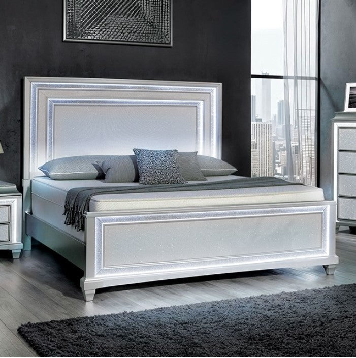 Aurielle gray bed in a modern bedroom with large windows and cityscape view.