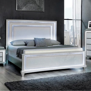 Aurielle gray bed in a modern bedroom with large windows and cityscape view.