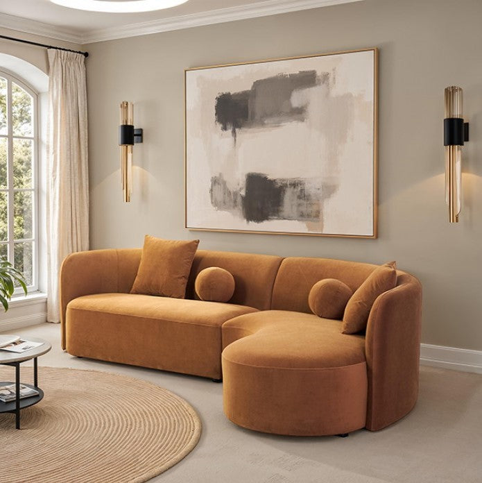 Azalia Modern Caramel Brown Circular Sectional Sofa Brown sectional sofa in a living room with abstract art and round rug.