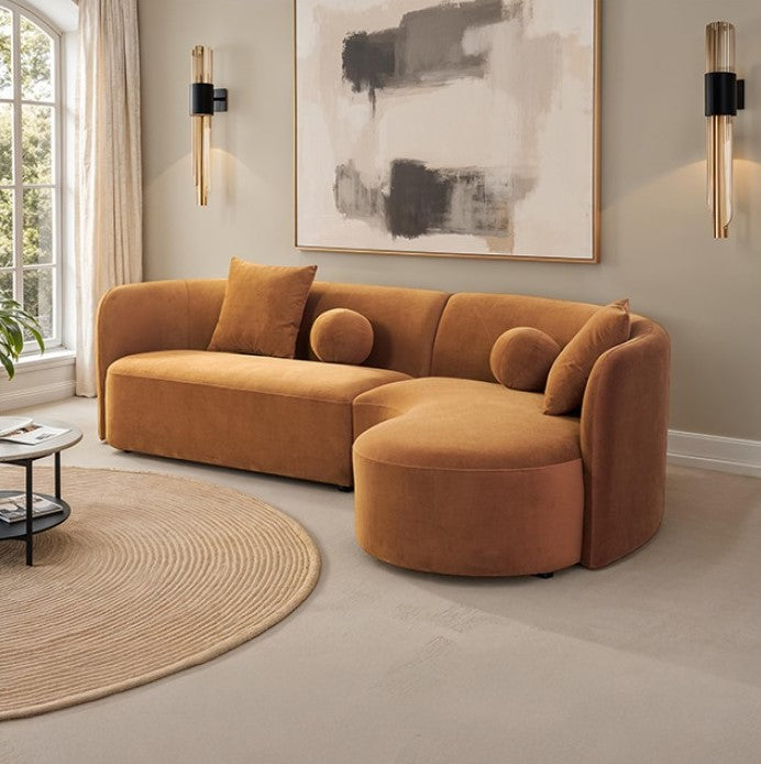Azalia Modern Caramel Brown Circular Sectional Sofa Brown sectional sofa in a living room with abstract art and round rug.