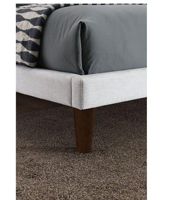 Bassetti Modern Style Shelter Padded White Bed Gray bed with wooden legs on a carpeted floor