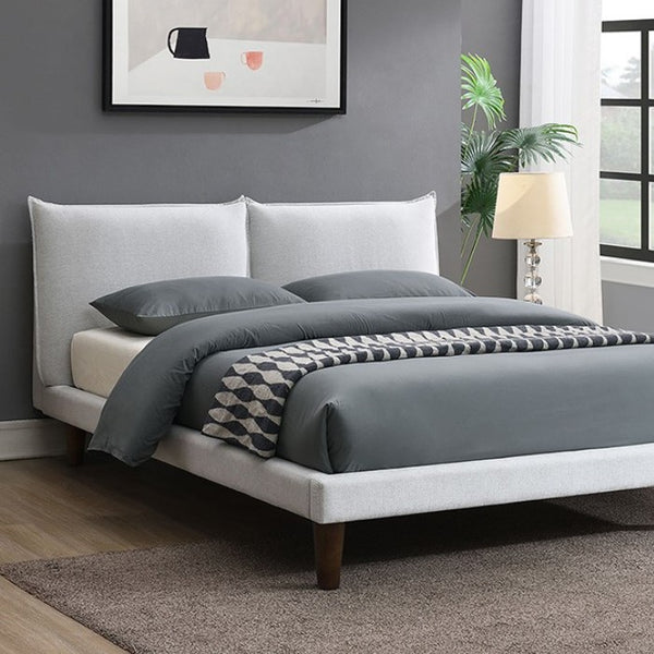 Bassetti Modern Style Shelter Padded White Bed Bedroom with a bed featuring gray bedding and a white headboard, a lamp, and a plant.