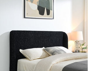 Bassetti Modern Style Shelter Padded Black Bed Style Bedroom with a black upholstered headboard, white bedding, and abstract art on the wall.