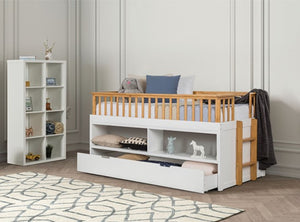 Bawin Open Shelf Bookcase Trundle Youth Bed Children's bed with wooden bars and white storage drawers in a room setting.