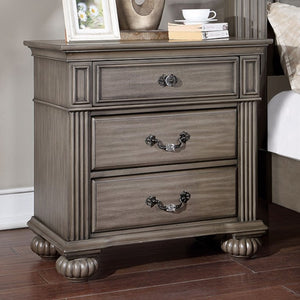 Bella Traditional Gray Nightstand Wooden nightstand with three drawers in a bedroom setting