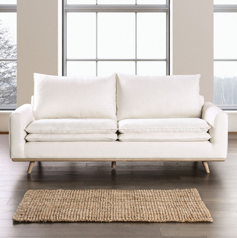 Bengie Modern Oak White Linen Fabric Sofa White sofa in a room with large windows and a rug on the floor.