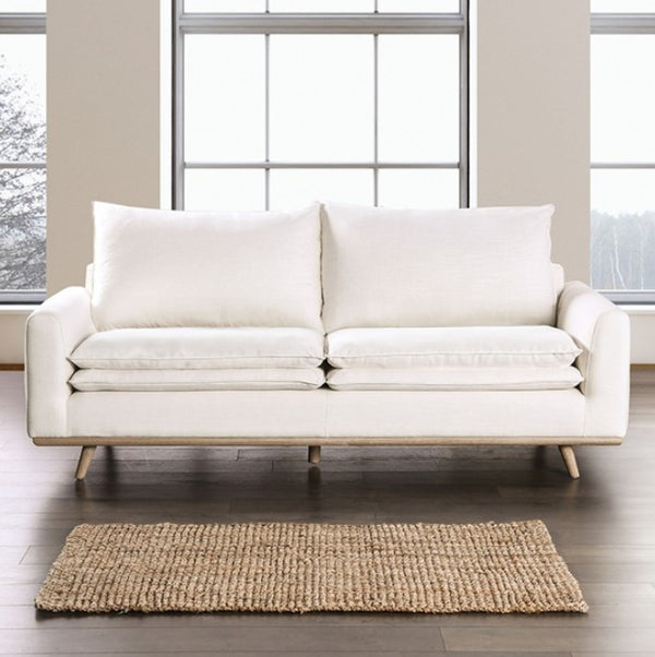 Bengie Modern Oak White Linen Fabric Sofa White sofa in a room with large windows and a rug on the floor.