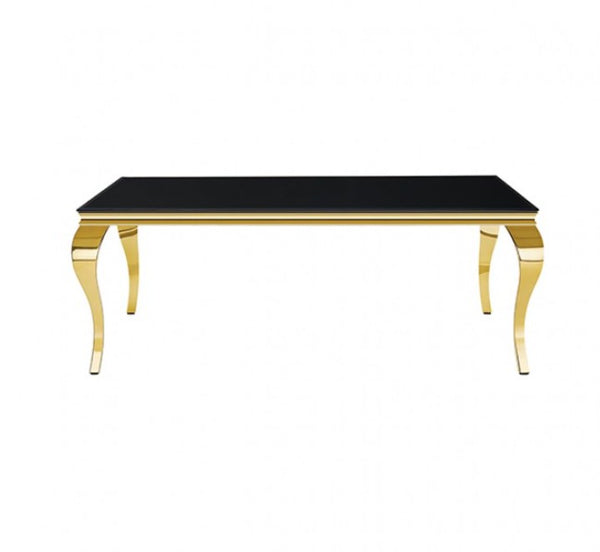 Betsy Black Glass Top Modern Dining Table A rectangular table with a glossy black glass top and polished gold-tone metal legs, shown against a plain white background.
