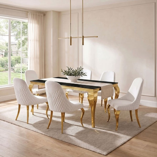 Betsy Black Glass Top Modern Dining Table A modern dining room set featuring a rectangular table with a black top and gold legs, surrounded by six white upholstered chairs with gold legs, set on a light beige rug in a bright room.
