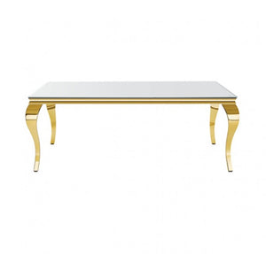 A rectangular table with a glossy white top and polished gold curved legs, shown against a plain white background.