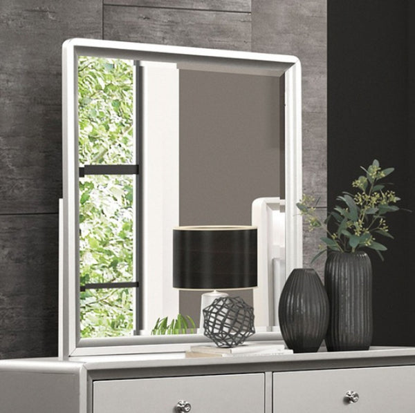 Borch Contemporary Champagne Finish Dresser A white-framed rectangular wall mirror with a split design, featuring a window pane view on the left and a reflective center panel, shown mounted on a dark gray textured wall above a white dresser with decorative vases and a lamp.