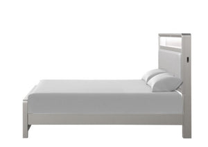 A modern single bed frame in a light gray finish, shown with a white mattress and two white pillows against a solid white background.