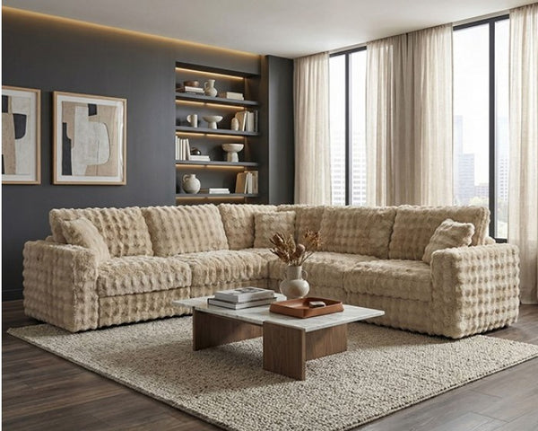Briana Modular Fabric Sand Sectional Sofa Modern living room with a textured beige sectional sofa, coffee table, and bookshelf.